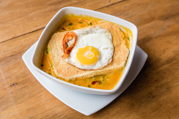 Peruvian Creole soup with toast and egg.