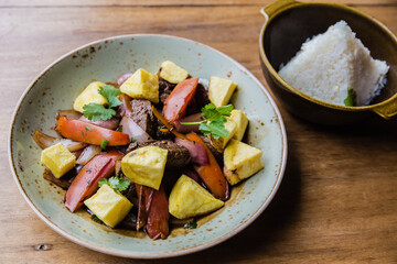 Jumped back. Peruvian food with loin, sweet bell pepper, tomato, potato and rice.