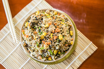 Rice with vegatles and animal protein. Asian food.