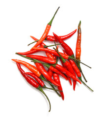  Stack red chili peppers and basil herb leaves  on the white