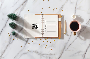 New Year Resolution Goal List 2020 - Business office desk with notebook about plan listing of new year goals and resolutions setting. Change and determination concept.