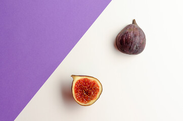 still life organic fig fruits, violet background. copy space