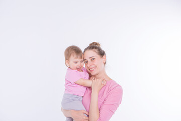 the concept of a healthy lifestyle, the protection of children, shopping - baby in the arms of the mother. Woman holding a child