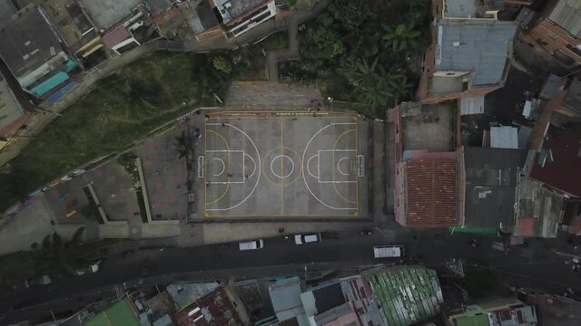 Top Down Aerial View of Basketball Court in Comuna Trece Slum, Medellin Colombia