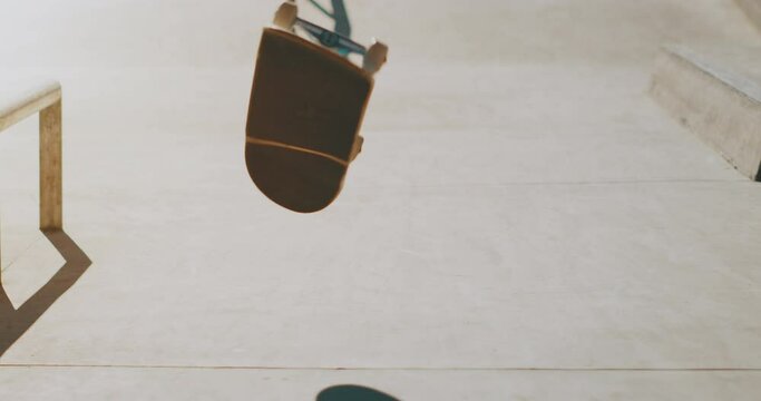 Skateboarder doing a kickflip in slow motion