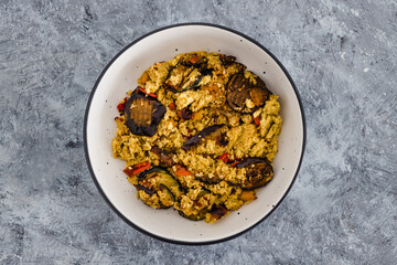 plant-based food, vegan cous cous with grilled aubergines and mediterranean vegetables