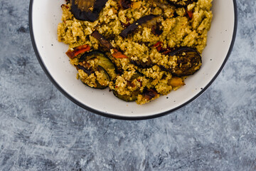 plant-based food, vegan cous cous with grilled aubergines and mediterranean vegetables