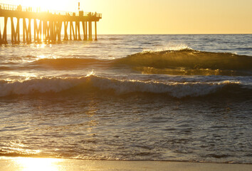 Waves crashing at sunset