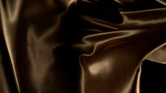Wavy satin fabric fluttering in the wind. Super slow motion at 1000 fps.