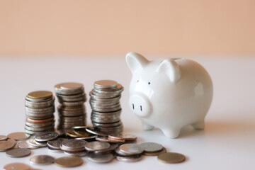 Saving piggy bank white pig on the floor Has a light pink background Convey to savings