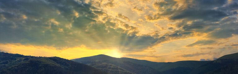 Orange panorama sunset sky and cloud with mountains