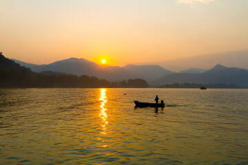Sunrise in the morning and small boat at Koh Chang