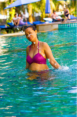 Obraz na płótnie Canvas Woman with bikini enjoy in pool