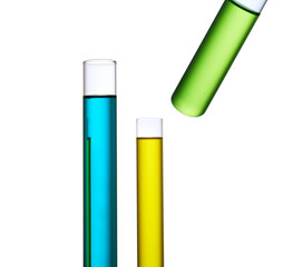Set with different laboratory glassware and liquid for analysis on white background