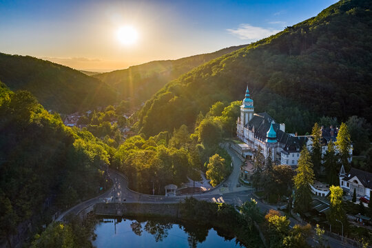 Lillafured, Hungary - Aerial view of the famous Lillafured Castle in the mountains of Bukk near Miskolc on a sunny summer morning. Rising sun with sunrays