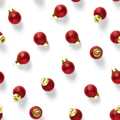 Seamless pattern with red Christmas decorations on white background. Christmas abstract background made from balls. Christmas red ornaments Seamless pattern.