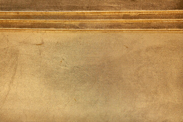 Gold background. Wooden surface covered with a layer of Golden texture paint.