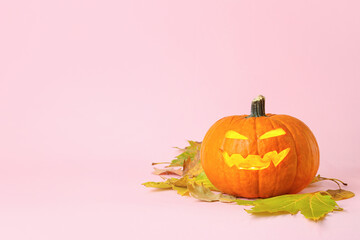 Carved Halloween pumpkin on color background