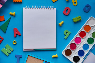 School supplies, stationery on blue background space for caption. Back to school concept. School, education and learning concept. creativity for kids. Top view colorful background. Flat lay
