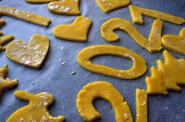 Shortbread liver of various shapes on a baking tray. 2021, christmas