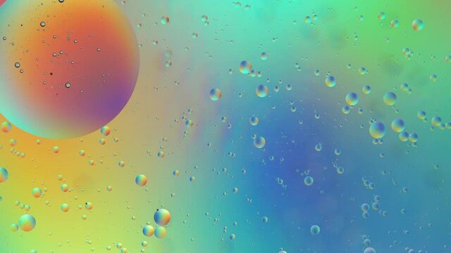 Oil drops on water surface. Abstract colorful backdrop. Pastel rainbow gradient color background