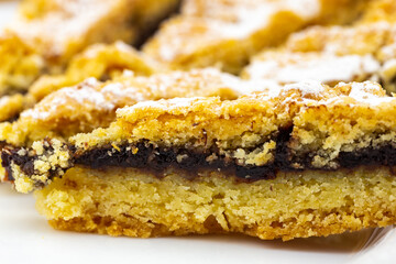 Tasty cake with powder sugar on top and plum stuff