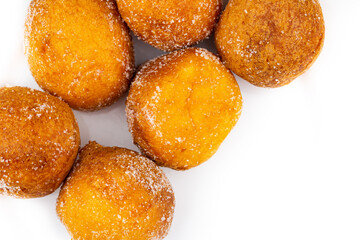 Sweet, small, round donuts on white background