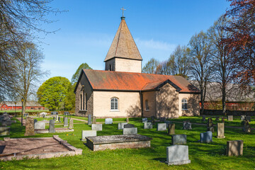 Fototapeta na wymiar Cemetery with a church in Sweden