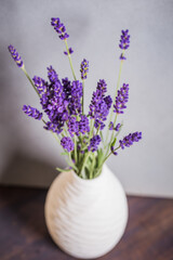 Fresh flowers of lavender bouquet on rustic wooden background