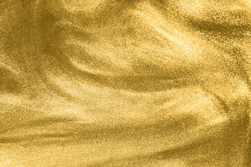 Blurred abstract elegant, detailed gold glitter particles flow with shallow depth of field...