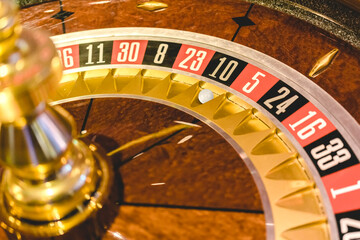 Close up view of roulette wheel with the ball.Gambling wheel in casino