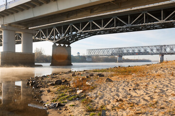 Railway bridge over the river Sozh in the sunset sunlight. Gomel. Belarus.