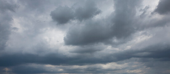 Naklejka na ściany i meble Clouds. Sky. Dark threatning rain clouds. Panorama.