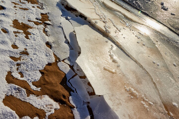 Ice hummock on Frozen River in winter sunny day. Sparkling ice texture or background.