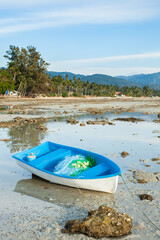 Naklejka na ściany i meble Small Thai Fishing Boat on Sand Beach.