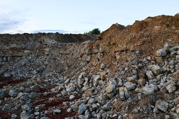 textures of various clay layers underground in  clay quarry after  geological study of  soil. colored layers of clay and stone in  section of  earth, different rock formations and soil layers.