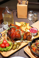 Baked pork knee. Fried beef liver with onions. Beer pub. Sports bar. Horseradish vodka and pork knee. Pork knee, vegetables and horseradish. 