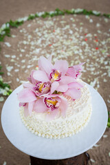 Obraz na płótnie Canvas Wedding Cake with Flowers on Top.