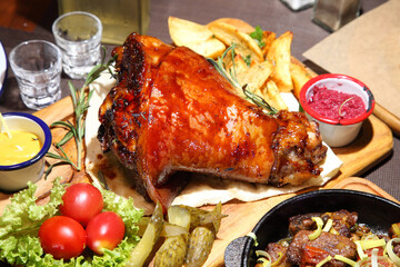 Baked pork knee. Fried beef liver with onions. Beer pub. Sports bar. Horseradish vodka and pork knee. Pork knee, vegetables and horseradish. 