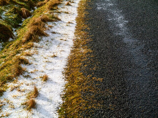 Snow patch on a side of a road, Winter cold season concept. Nobody.