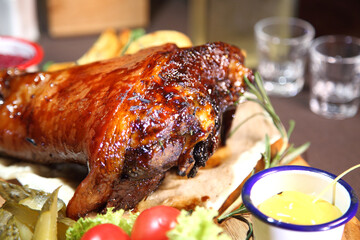 Baked pork knee. Fried beef liver with onions. Beer pub. Sports bar. Horseradish vodka and pork knee. Pork knee, vegetables and horseradish. 