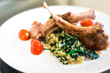 Closeup of a meat dish on a white plate