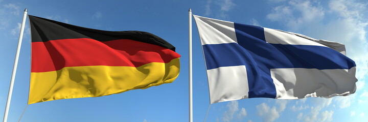 Flying flags of Germany and Finland on sky background, 3d rendering