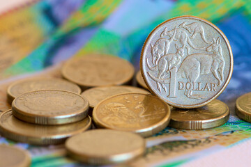 Australian dollar coin with dollar notes.