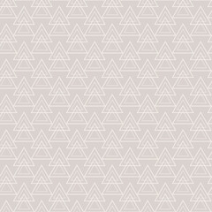 Abstract seamless pattern with white triangles on a gray background