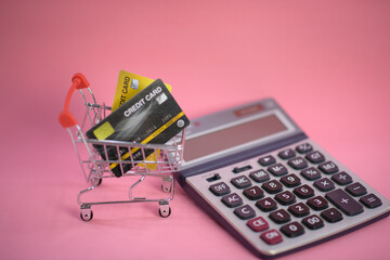 shopping cart with credit card ,Calculator ,shopping online concept