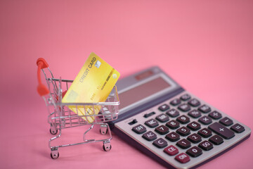 shopping cart with credit card ,Calculator ,shopping online concept