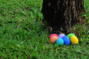 Variety of colorful Easter eggs on grass, selective focus