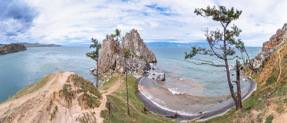 A panoramic view of the sacred Shamanka rock against the backdrop of a dramatic sky and stormy...