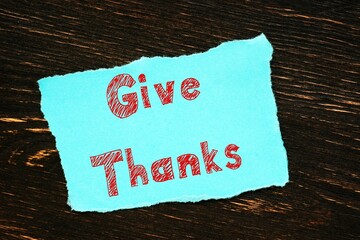 Business concept about Give Thanks with phrase on the piece of paper.